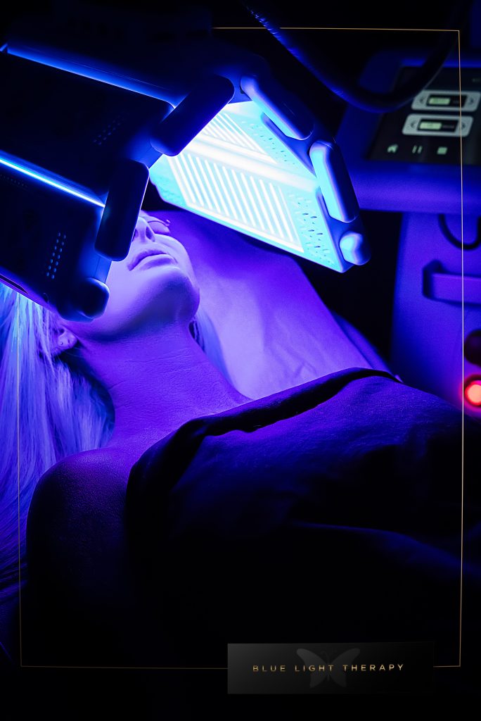 A woman getting a blue light therapy treatment in las vegas at rarev medspa